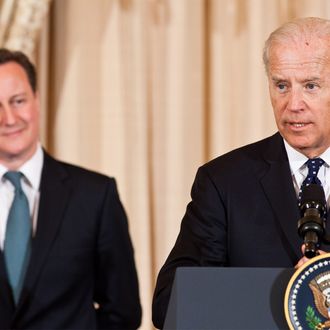 British Prime Minister David Cameron (L) listens as U.S. Vice President Joe Biden makes a toast during a lunch hosted at the State Department on March 14, 2012 in Washington, DC.