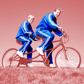 Couple riding on a tandem bicycle