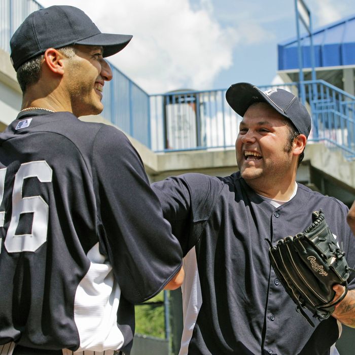 Andy Pettitte, (46) who came out of retirement on a minor league contract to pitch for his former team, jokes around with Yankees reliever Joba Chamberlain after throwing in the bullpen at the Yankees spring training facility at Steinbrenner Field in Tampa, Fla., Tuesday, March 20, 2012. (AP Photo/Kathy Willens)