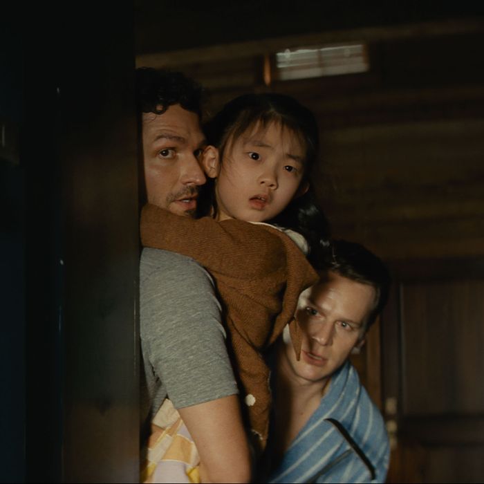Ben Aldridge, Kristen Cui, and Jonathan Groff in Knock at the Cabin. 