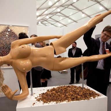 There were lots of tasty snacks to be had at Frieze: a slice of wood-fired pizza from Roberta’s; a scoop of artisanal ice cream from Van Leeuwen; a pretzel from the Standard Biergarten; and an oily walnut from this woman’s crotch. That’s right, she’s a nutcracker: place the nut, pull down the leg, retrieve, eat. We noticed that many people weren’t eating their nuts, though — they were just abandoning them in the pile of greasy shells accumulating on the tabletop. (We admit we didn’t eat ours, either.)