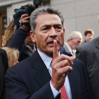 Rajat Kumar Gupta, former Goldman Sachs board member, leaves a Manhattan court after he surrendered to federal authorities October 26, 2011 in New York City. Gupta is charged with conspiracy and securities fraud, stemming from a massive hedge fund insider trading case.