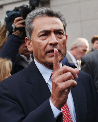 Rajat Kumar Gupta, former Goldman Sachs board member, leaves a Manhattan court after he surrendered to federal authorities October 26, 2011 in New York City. Gupta is charged with conspiracy and securities fraud, stemming from a massive hedge fund insider trading case.