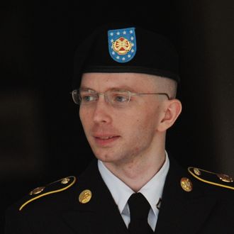 Army Pfc. Bradley Manning is escorted from court on July 25, 2013 in Fort Meade, Maryland on July 25, 2013. The trial of Manning, accused of 