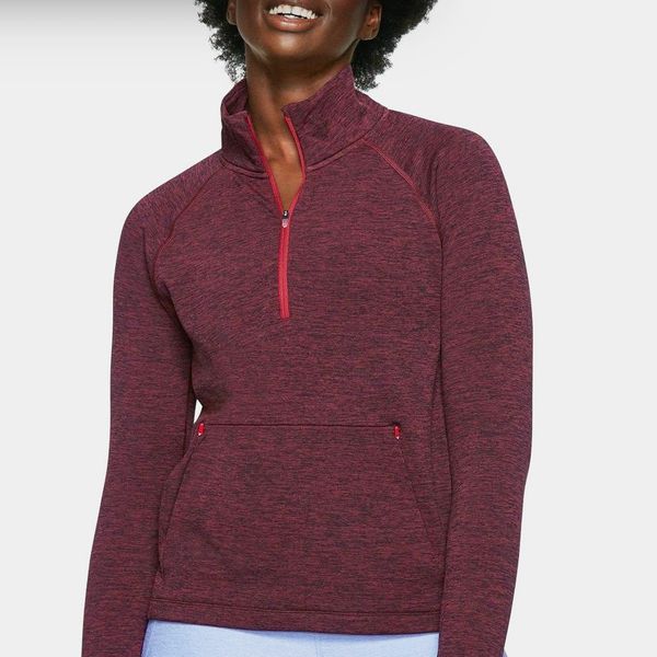 An athleisure Outdoor Voices OVFleece Half-Zip in a heathered maroon with pink trim 
