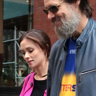 Jim Carrey and Cathriona White leave their hotel hand in hand