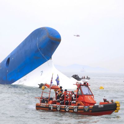 In this handout provided by Donga Daily, The Republic of Korea Coast Guard work at the site of ferry sinking accident off the coast of Jindo Island on April 16, 2014 in Jindo-gun, South Korea. Four people are confirmed dead and almost 300 are reported missing. The ferry identified as the Sewol is reported to have been carrying around 470 passengers, including students and teachers, as it travelled to Jeju island. 