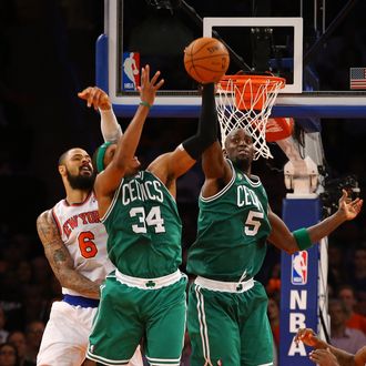 Kevin Garnett #5 of the Boston Celtics and Paul Pierce #34 deflect a shot against the New York Knicks during Game five of the Eastern Conference Quarterfinals of the 2013 NBA Playoffs at Madison Square Garden on May 1, 2013 in New York City. NOTE TO USER: User expressly acknowledges and agrees that, by downloading and or using this photograph, User is consenting to the terms and conditions of the Getty Images License Agreement. 