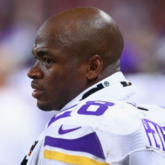 ST. LOUIS, MO - SEPTEMBER 7: Adrian Peterson #28 of the Minnesota Vikings looks on from the sideline during a game against the St. Louis Rams at the Edward Jones Dome on September 7, 2014 in St. Louis, Missouri. The Vikings beat the Rams 34-6. (Photo by Dilip Vishwanat/Getty Images)