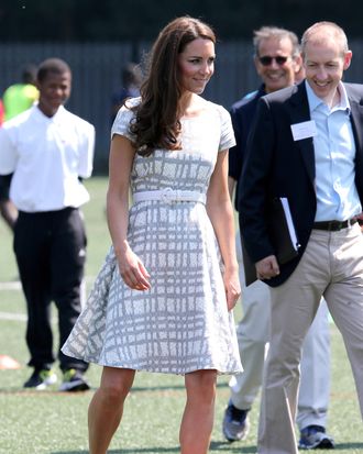 Catherine, Duchess of Cambridge kicks a football on the football pitch as she visits Bacon's College on July 26, 2012 in London, England. Prince Harry, Prince William, Duke of Cambridge and Catherine, Duchess of Cambridge visited Bacon's College and launched the 'Coach Core' Programme, a partnership between their Foundation and Greenhouse.