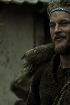 Ragnar rocking a headband, making us picture him as a drummer for eighties glam band Ratt.