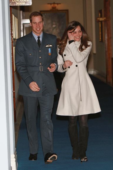 Britain’s Prince William (L) is pictured with his girlfriend Kate Middleton after his graduation ceremony at RAF Cranwell air base in Lincolnshire, on April 11, 2008. Britain’s Prince William graduated as a Royal Air Force (RAF) pilot on Friday after successfully completing an intensive flying course.The prince, 25, received his wings from his father Prince Charles in a graduation ceremony at the RAF Cranwell air base in Lincolnshire, east central England. AFP PHOTO/MICHAEL DUNLEA/POOL (Photo credit should read MICHAEL DUNLEA/AFP/Getty Images)