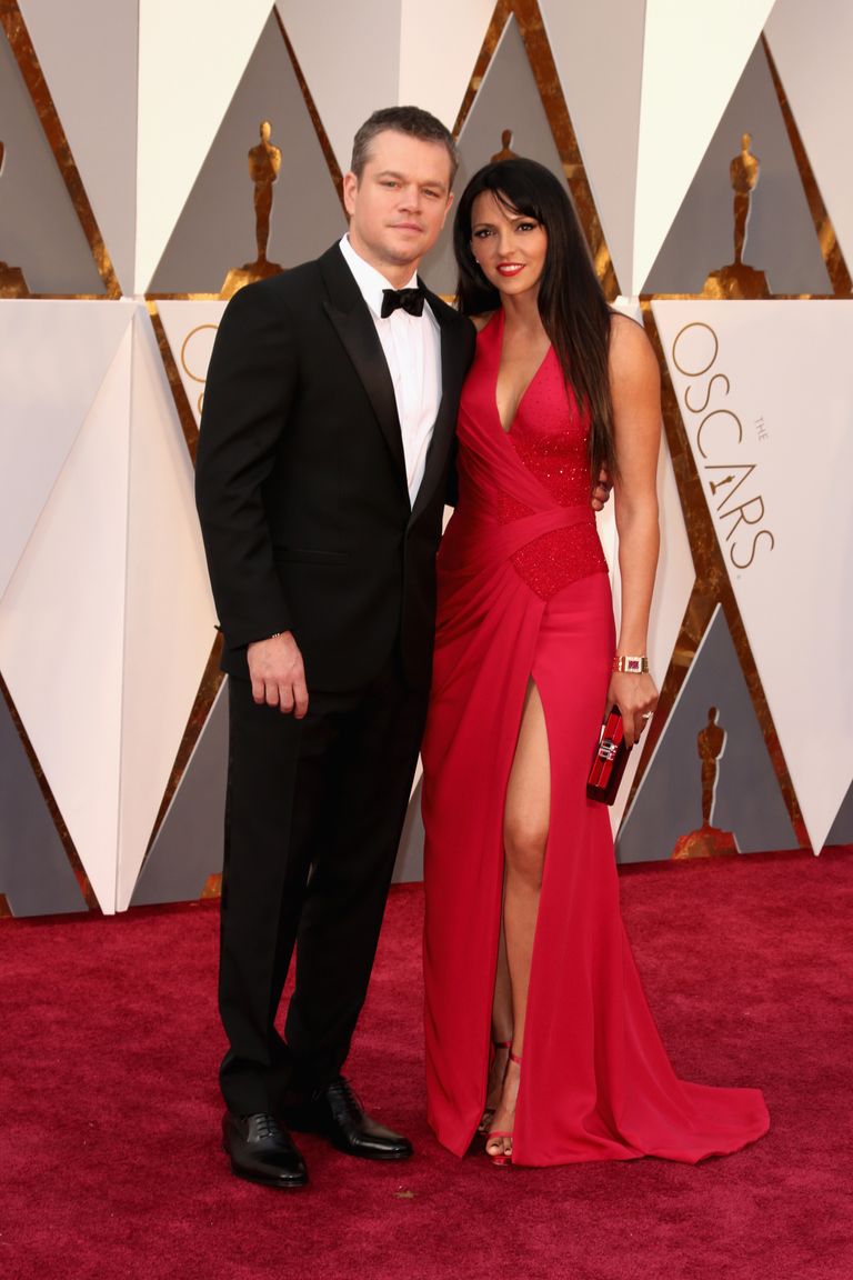 Matt Damon and Luciana Damon 
Suit by Versace; dress by Atelier Versace.