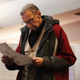 A voter studies his completed ballot at a polling station on November 5, 2013 in the Brooklyn borough of New York City. New Yorkers went to the polls to choose between Democratic candidate Bill de Blasio and Republican Joe Lhota. De Blasio was widely considered the favorite going into election day.