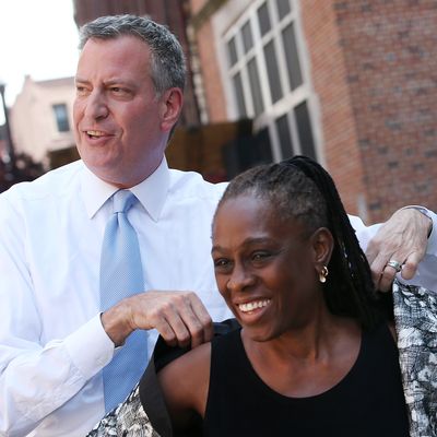 NEW YORK, NY - AUGUST 15: New York City Democratic Mayoral candidate Bill de Blasio (L) stands with his wife Chirlane McCray before a press conference outside the East Side Community High School on August 15, 2013 in New York City. De Blasio spoke about his plan to tax the wealthy in order to expand city's after-school programs. (Photo by Mario Tama/Getty Images)
