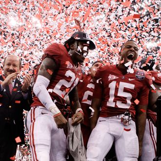 Dre Kirkpatrick #21 and Darius Hanks #15 of the Alabama Crimson Tide celebrate after defeating Louisiana State University Tigers in the 2012 Allstate BCS National Championship Game 