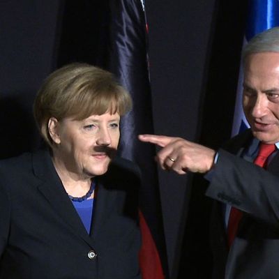 In this video-grab, German Chancellor Angela Merkel (L) and Israeli Prime Minister Benjamin Netanyahu gesture during a joint press conference after their cabinets held a meeting at the King David hotel in Jerusalem on February 25, 2014. Merkel arrived in Israel with her cabinet yesterday to discuss nuclear talks with Iran and to encourage Prime Minister Netanyahu to reach a two-state solution with the Palestinians. 