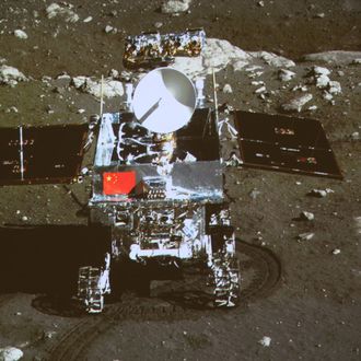 In this image taken by the on-board camera of the lunar probe Chang'e-3 and made off the screen of the Beijing Aerospace Control Center in Beijing, China's first moon rover 'Yutu' - or Jade Rabbit - is on the lunar surface in the area known as Sinus Iridum (Bay of Rainbows) Sunday, Dec. 15, 2013. Yutu touched down on the moon and left deep traces on its loose soil, state media reported Sunday, several hours after the country successfully carried out the world's first soft landing of a space probe on the moon in nearly four decades.