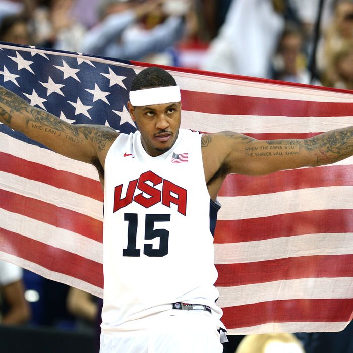 US forward Carmelo Anthony celebrates after the London 2012 Olympic Games men's gold medal basketball game between USA and Spain at the North Greenwich Arena in London on August 12, 2012.