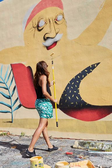 Artist Marina Capdevila paints a mural in Winwood.