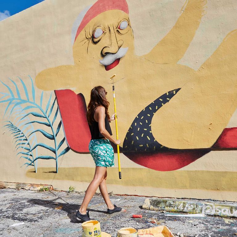 Artist Marina Capdevila paints a mural in Winwood.