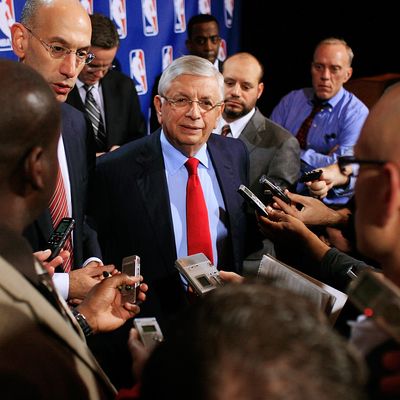 NBA Commissioner David Stern (C) and NBA Deputy Commissioner Adam Silver speak to members of the media after a press conference after the NBA and NBA Player's Association met to negotiate the CBA at The Helmsley Hotel on November 10, 2011 in New York City. 