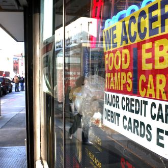 NEW YORK - OCTOBER 07: A sign in a market window advertises the acceptance of food stamps on October 7, 2010 in New York City. New York Mayor Michael Bloomberg is proposing an initiative that would prohibit New York City's 1.7 million food stamp recipients from using the stamps, a subsidy for poor residents, to buy soda or other sugary drinks. Bloomberg has stressed that obesity among the poor has reached critical levels. (Photo by Spencer Platt/Getty Images)