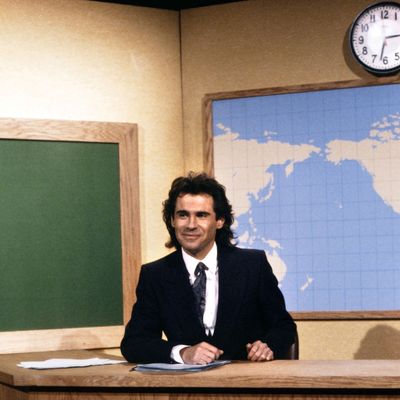 SATURDAY NIGHT LIVE -- Episode 4 -- Pictured: Dennis Miller during the 'Weekend Update' on November 15, 1986.
