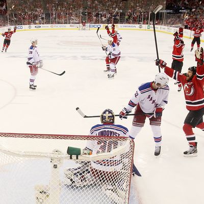 NEWARK, NJ - MAY 21: Travis Zajac #19 of the New Jersey Devils celebrates scoring a first period goal past Henrik Lundqvist #30 of the New York Rangers in Game Four of the Eastern Conference Final during the 2012 NHL Stanley Cup Playoffs at the Prudential Center on May 21, 2012 in Newark, New Jersey. (Photo by Bruce Bennett/Getty Images)