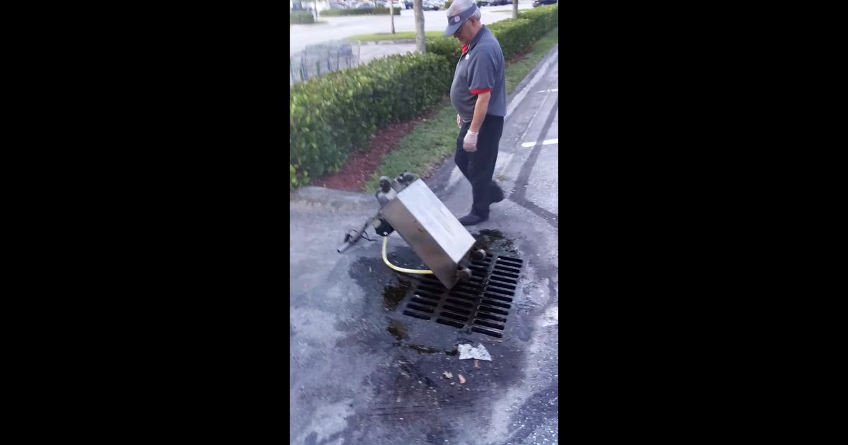 Here’s a Burger King Employee Casually Dumping Cooking Oil Into a Storm