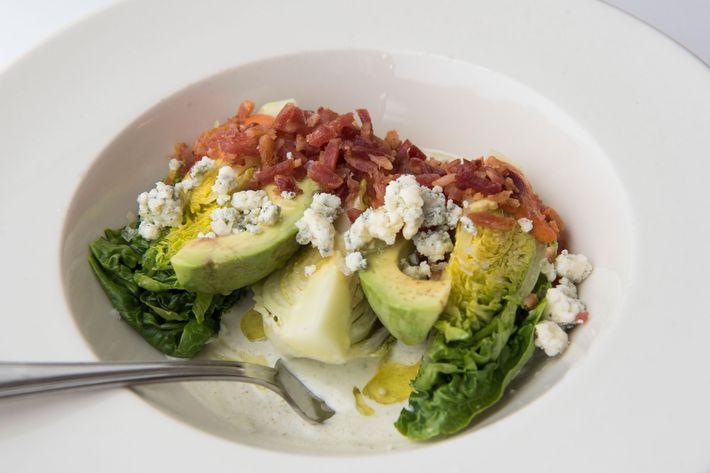 Baby gem salad with avocado, bacon, and blue cheese.