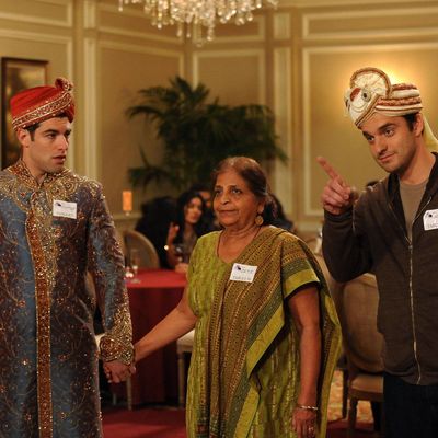 NEW GIRL: Schmidt (Max Greenfield, L) and Nick (Jake Johnson, R) play a game with an older Indian woman (guest star Swati Panat, C) when they attend a dating convention in the 