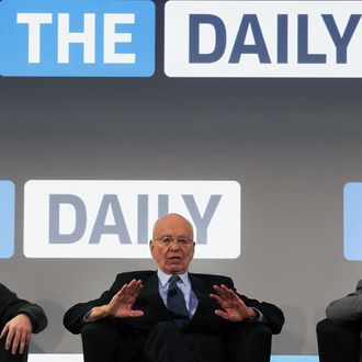 NEW YORK, NY - FEBRUARY 02: News Corp. CEO Rupert Murdoch (C) sits on stage with The Daily editor Jesse Angelo (R) and Eddy Cue, VP of Internet Services at Apple, for the launch of his new online newspaper for the Apple iPad called The Daily on February 2, 2011 at the Guggenheim Museum in New York City. The new media product is owned by News Corp. and will be sold for 14 cents a day. (Photo by Spencer Platt/Getty Images) *** Local Caption *** Rupert Murdoch;Eddy Cue;Jesse Angelo