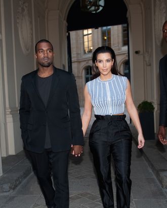 Singer Kanye West and Kim Kardashian are seen leaving the Louis Vuitton aftershow new boutique opening on July 3, 2012 in Paris, France.