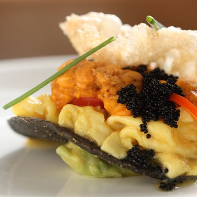 Soft scrambled eggs with sea urchin, jalapeño pickles, and chicharrón.