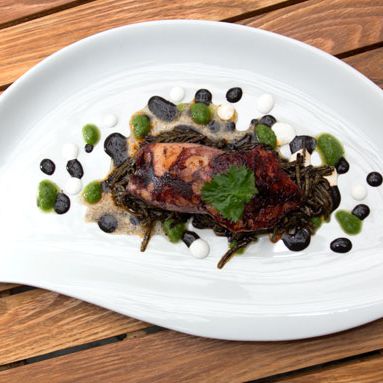 Whole roasted calamari and its fideus, green chorizo, tomatillo, black beans.