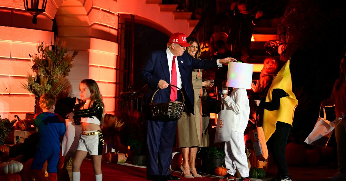 Trump Plays the Hits, Puts Halloween Candy on a Kid's Head
