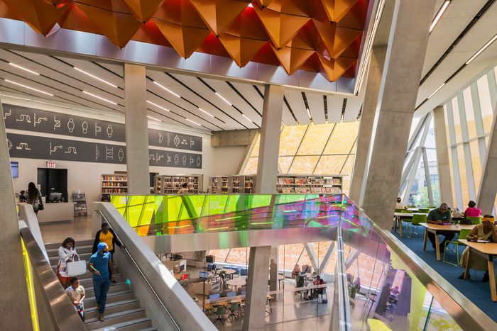 At Far Rockaway, the metal origami on the ceiling is intended to diffuse sound; the dichroic glass railings change color as you pass.