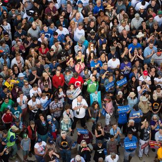 A crowd gathers to watch as Democratic presidential candidate Bernie Sanders speaks during a rally in Oakland, California on May 30, 2016.