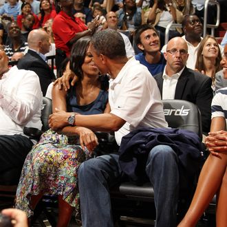 President of the United States of America Barack Obama and First Lady Michelle Obama are put on the Kiss Cam at the 2012 US Men's Senior National Team vs the Brazilian Men's Senior National Team game at the Verizon Center on July 16, 2012 in Washington, DC. 