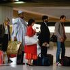 Travelers in Charles de Gaulle Airport