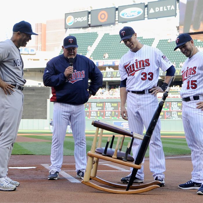 Mariano Rivera #42 of the New York Yankees is presented with a rocking chair made out of broken bats by manager Ron Gardenhire #35, Justin Morneau #33 and Glen Perkins #15 of the Minnesota Twins before the game on July 2, 2013 at Target Field in Minneapolis, Minnesota. 