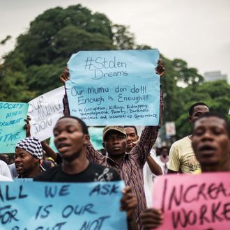 LAGOS, NIGERIA - MAY 01: Nigerians march during a demonstration to demand government to rescue schoolgirls abducted by suspected Boko Haram militants two weeks ago, in Lagos, Nigeria on May 01, 2014. On April 14, militants stormed the Government Girls Secondary School in Chibok, located on the fringes of the Sambisa Forest a known Boko Haram hideout in the restive northern state of Borno. They loaded scores of schoolgirls onto their trucks before driving away unhindered. The local authorities say 129 girls went missing that night, including 52 who have since returned. Some parents, however, claim a total of 234 schoolchildren were abducted. (Photo by Mohammed Elshamy/Anadolu Agency/Getty Images)