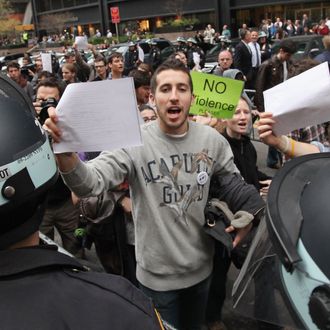 NEW YORK, NY - NOVEMBER 15: Protesters carry copies of a court order outside Zuccotti Park after police removed the Occupy Wall Street protesters from the park early in the morning on November 15, 2011 in New York City. Hundreds of protesters, who rallied against inequality in America, have slept in tents and under tarps since September 17 in Zuccotti Park, which has since become the epicenter of the global Occupy movement. The raid in New York City follows recent similar moves in Oakland, California, and Portland, Oregon. (Photo by Mario Tama/Getty Images)