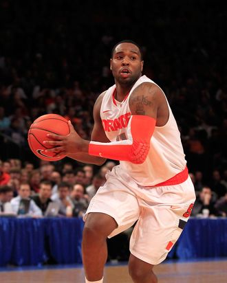 Scoop Jardine #11 of the Syracuse Orange handles the ball against the Cincinnati Bearcats during the semifinals of the Big East men's basketball tournament at Madison Square Garden on March 9, 2012 in New York City.