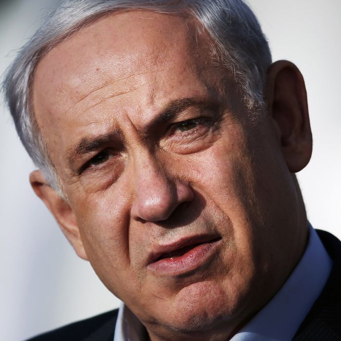 Israeli Prime Minister Benjamin Netanyahu delivers a statement at the Israeli Defense forces headquarters on June 16, 2014 in Jerusalem. Netanyahu demanded Palestinian president Mahmud Abbas's help in securing the release of three Israeli kidnapped teenagers, as the army launched a massive crackdown on Islamist movement Hamas. 