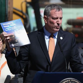 NEW YORK, NY - MAY 05: New York City Mayor Bill de Blasio speaks in front of a residential construction site while unveiling his affordable housing plan on May 5, 2014 in the Brooklyn borough of New York City. The mayor's $41 billion 'Housing New York - A Five-Borough Ten-Year Plan', billed by his office as the most ambitious affordable housing plan in U.S. history, plans to build or preserve 200,000 apartments in the next decade. The project would serve more than half a million low and middle income New Yorkers. New York City has some of the highest rents and property values in the nation. (Photo by John Moore/Getty Images)
