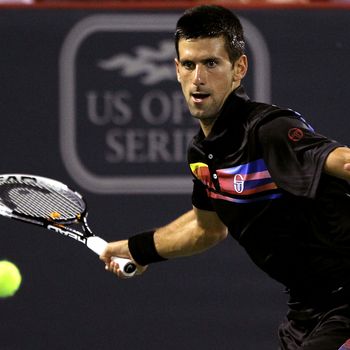 MONTREAL, QC - AUGUST 13: Novak Djokovic of Serbia returns a shot to Jo-Wilfried Tsonga of France during the Rogers Cup at Uniprix Stadium on August 13, 2011 in Montreal, Canada. (Photo by Matthew Stockman/Getty Images)