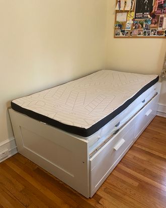 A mattress topper on a daybed.