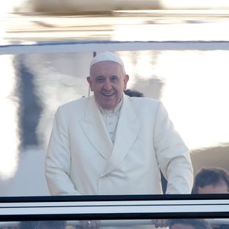 VATICAN CITY, VATICAN - APRIL 16: Pope Francis arrives on his Popemobile for his weekly audience in St. Peter's Square on April 16, 2014 in Vatican City, Vatican. Today the Holy Father held his audience on the Wednesday of Holy Week or 'Spy Wednesday' as it is called in many parts of the English-speaking world. (Photo by Franco Origlia/Getty Images)
